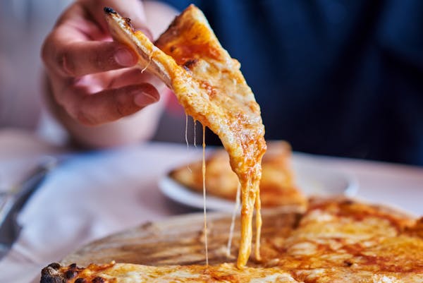 a close up of a slice of pizza