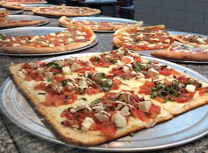 a pizza sitting on top of a table