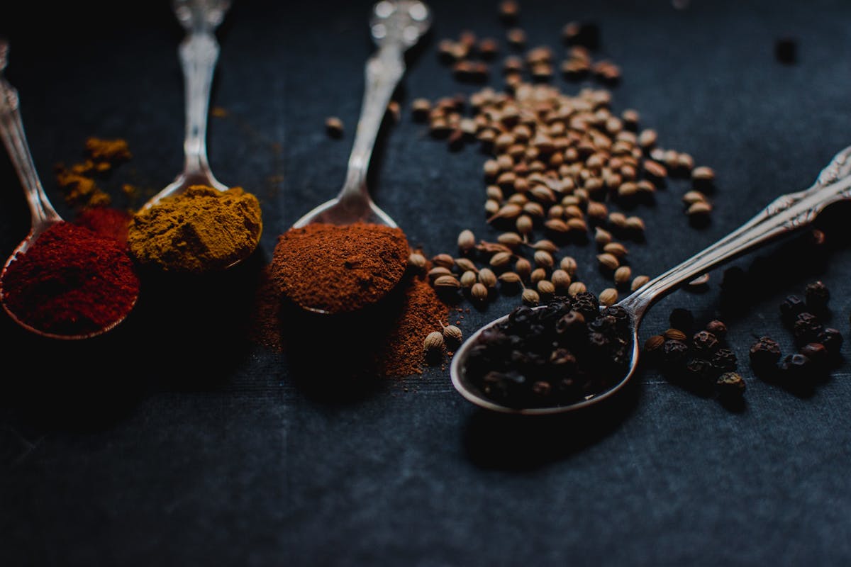 a close up of different spices on a table