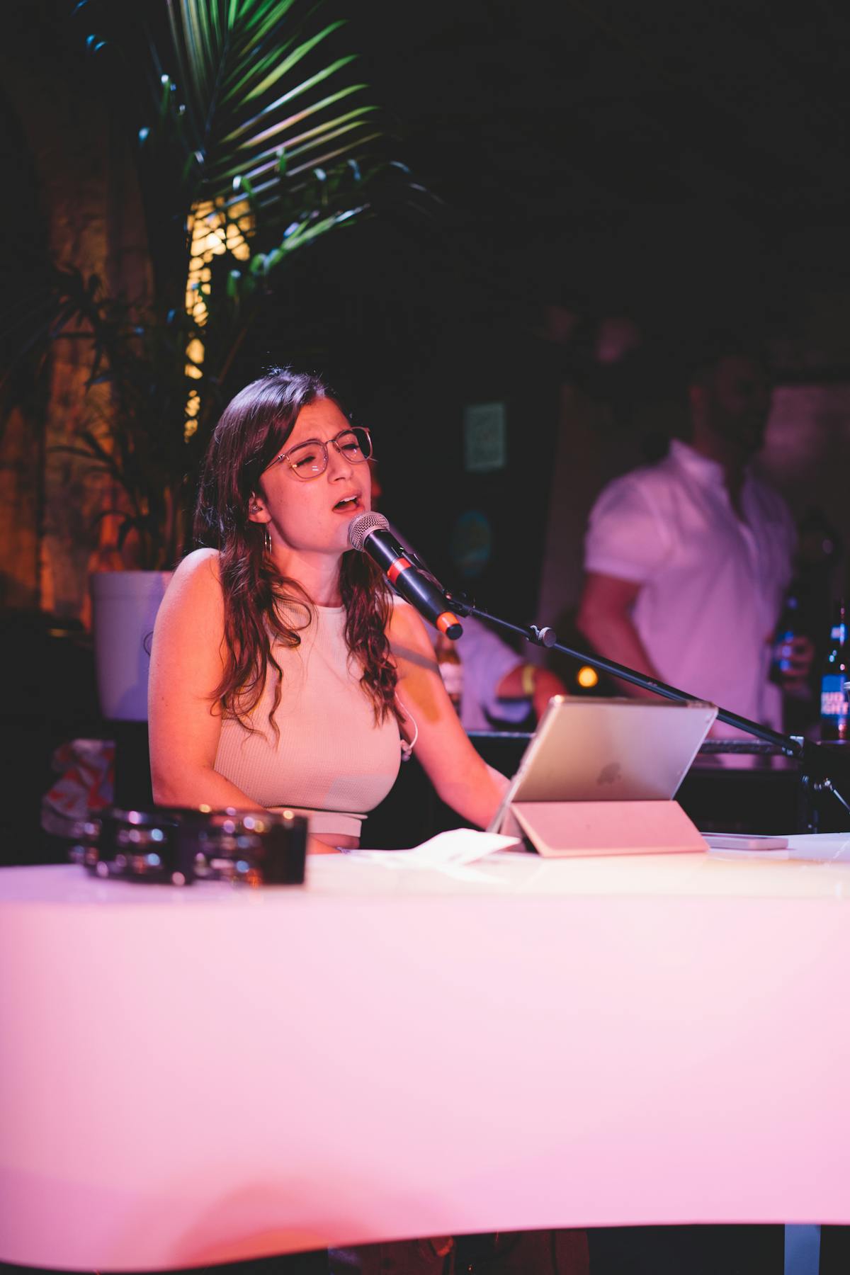 a person standing in front of a laptop