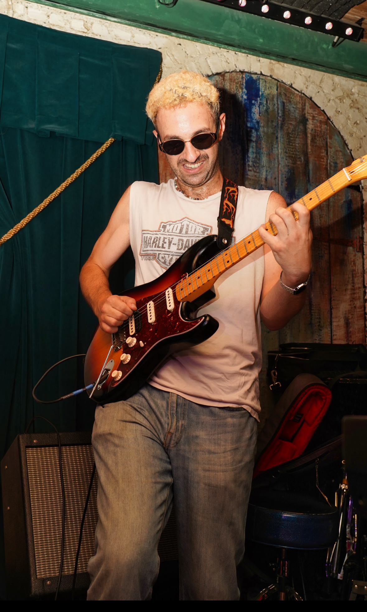 blonde playing guitar