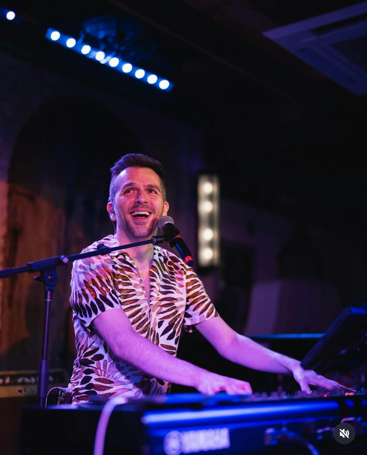 a man sitting on a stage