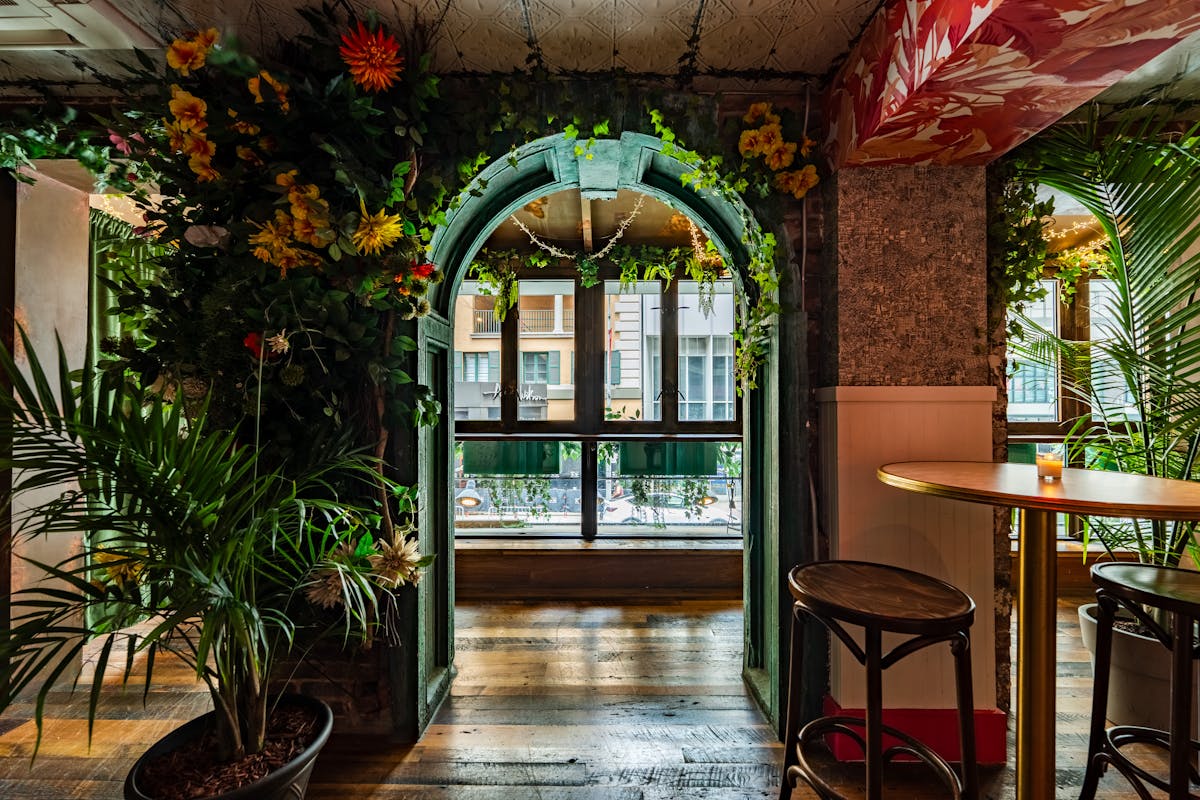 a dining room table in front of a window
