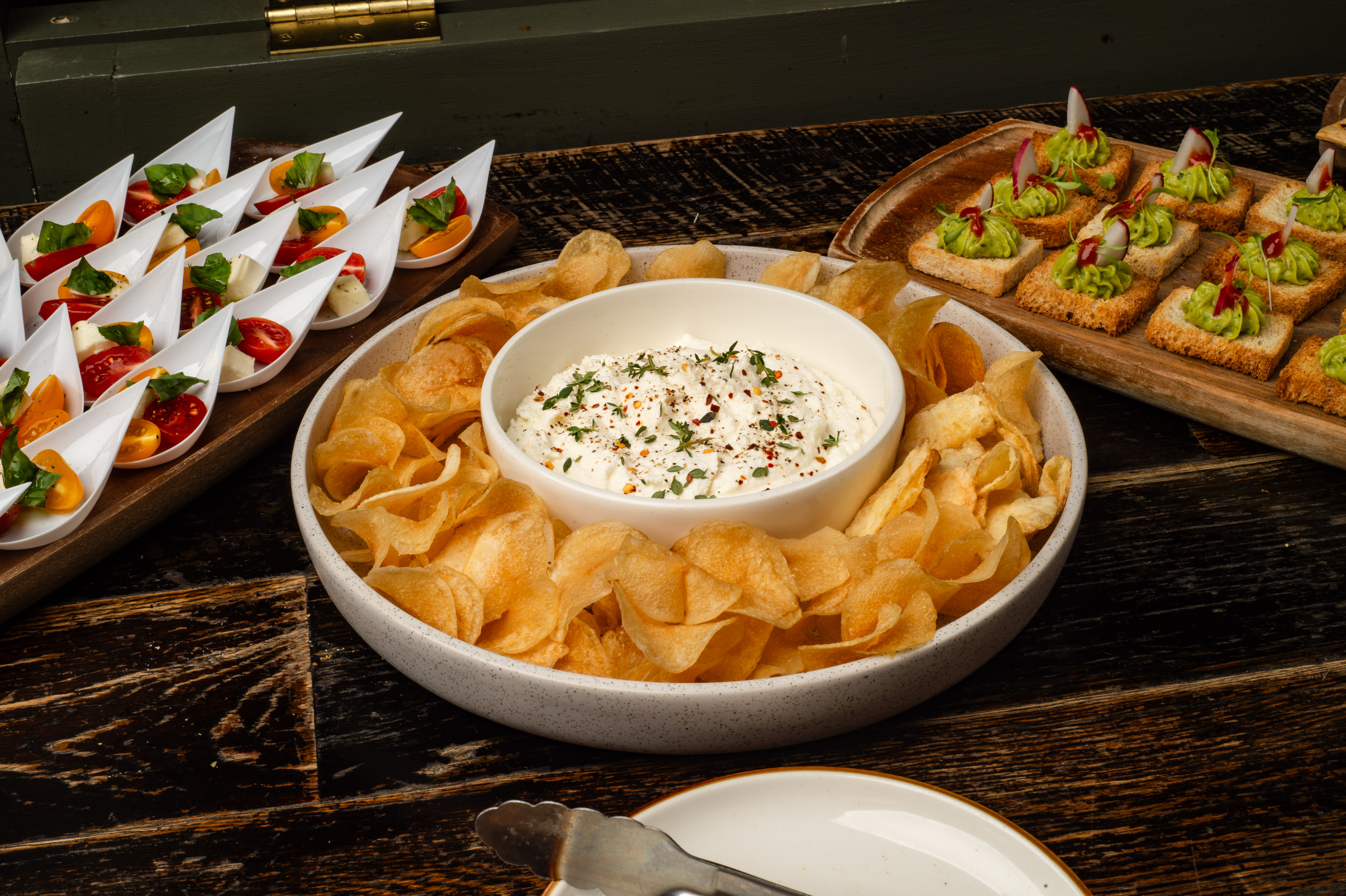 a plate of chips and dip on a table