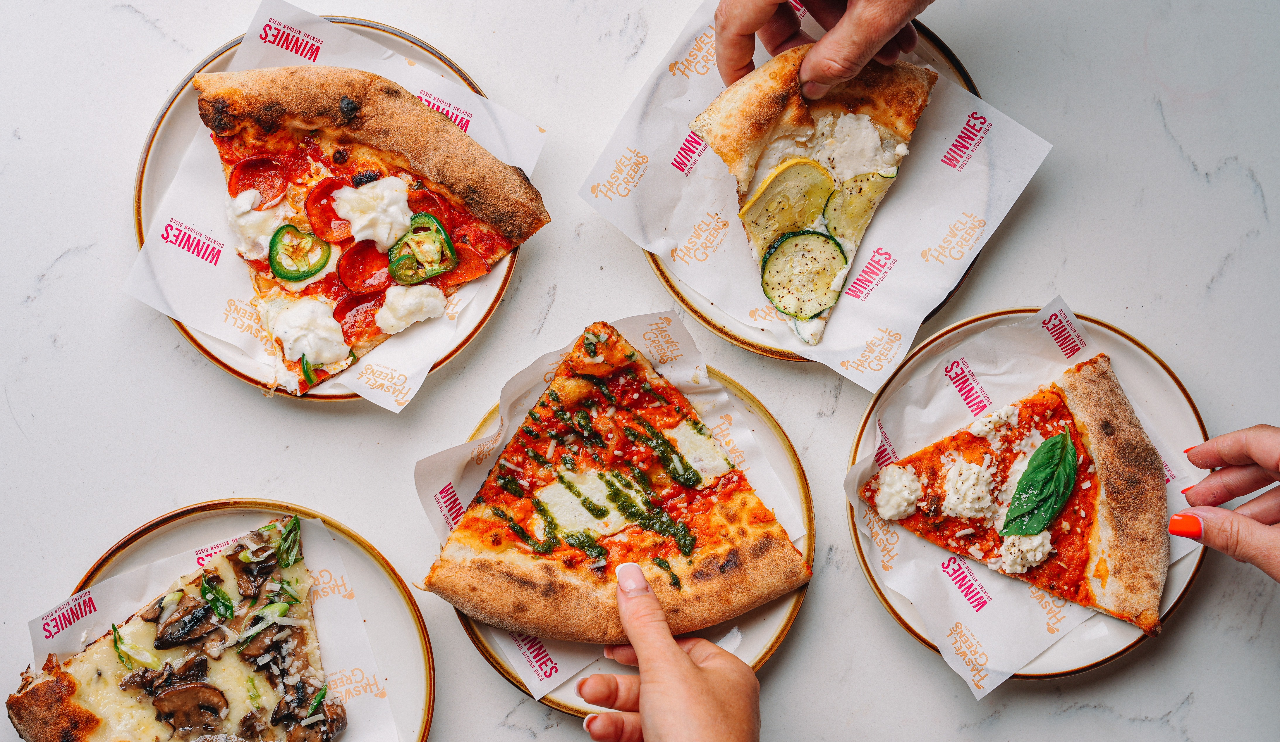 a plate of food with a slice of pizza