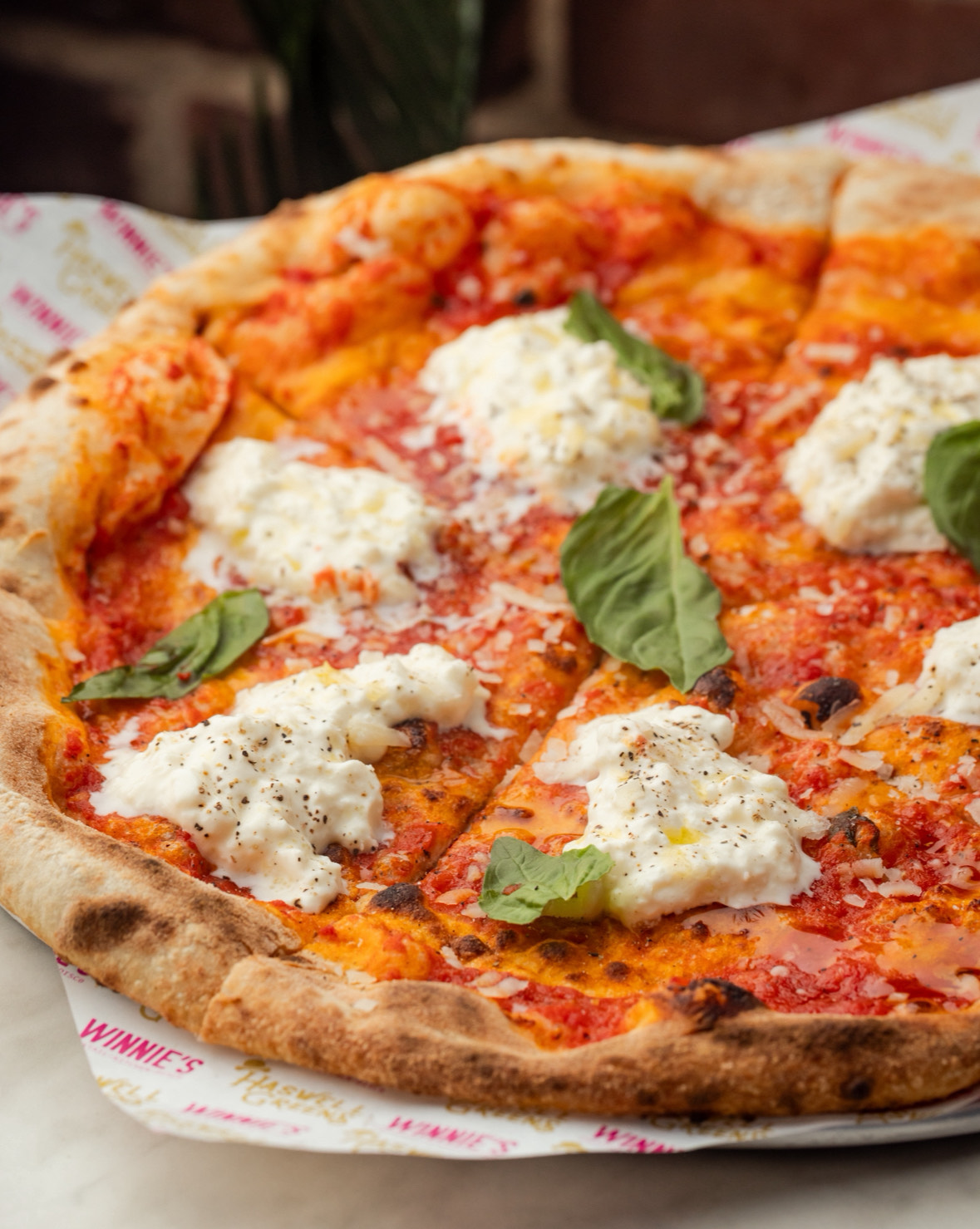 a pizza sitting on top of a table