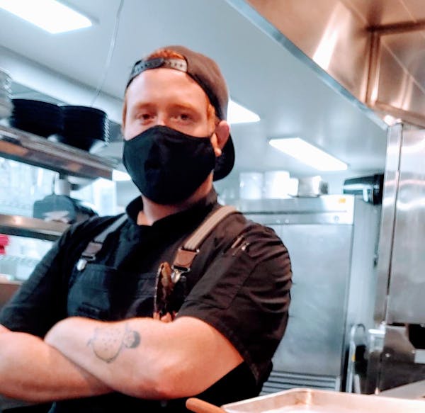 a person standing in a kitchen