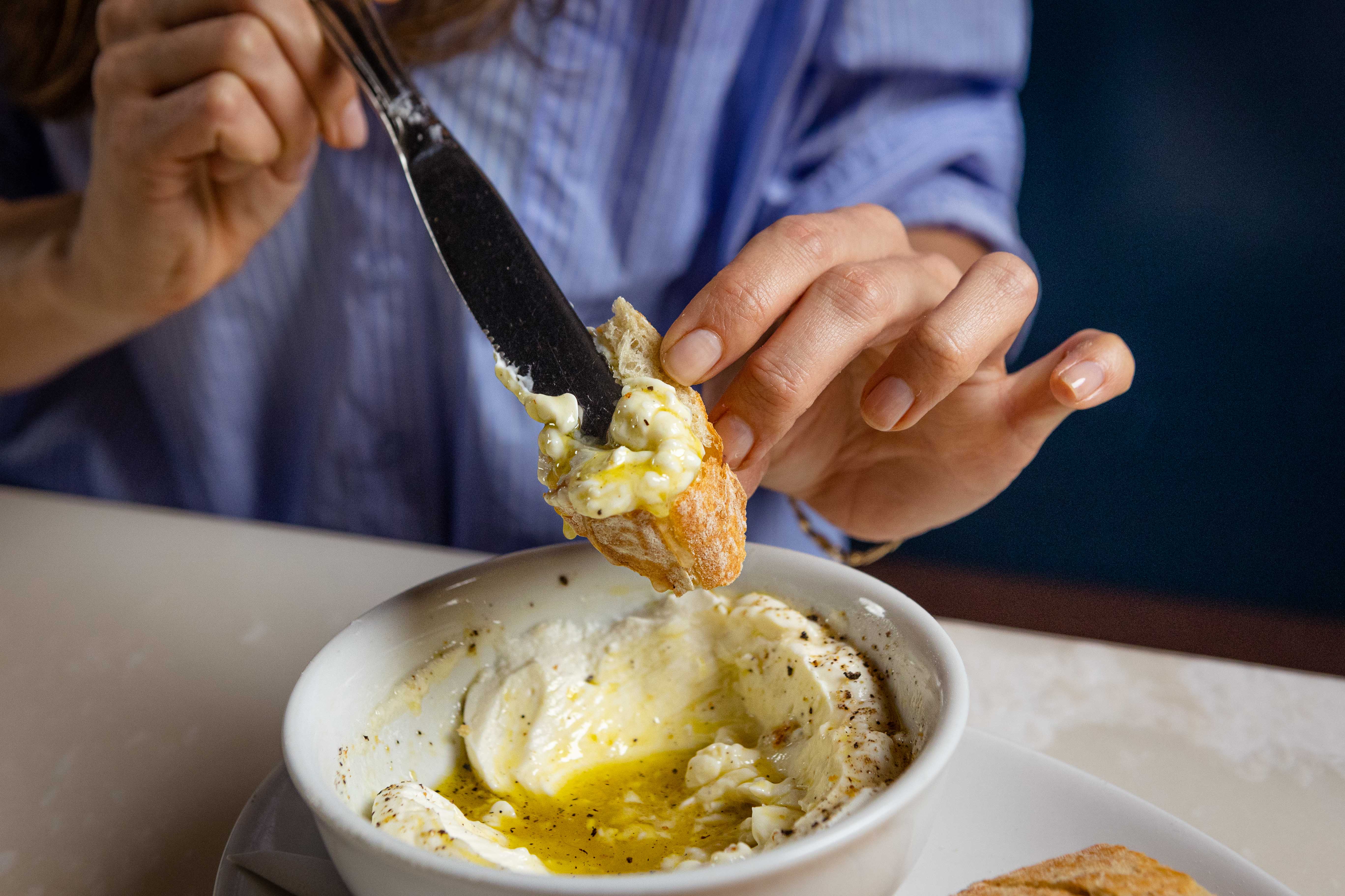 a person holding a plate of food