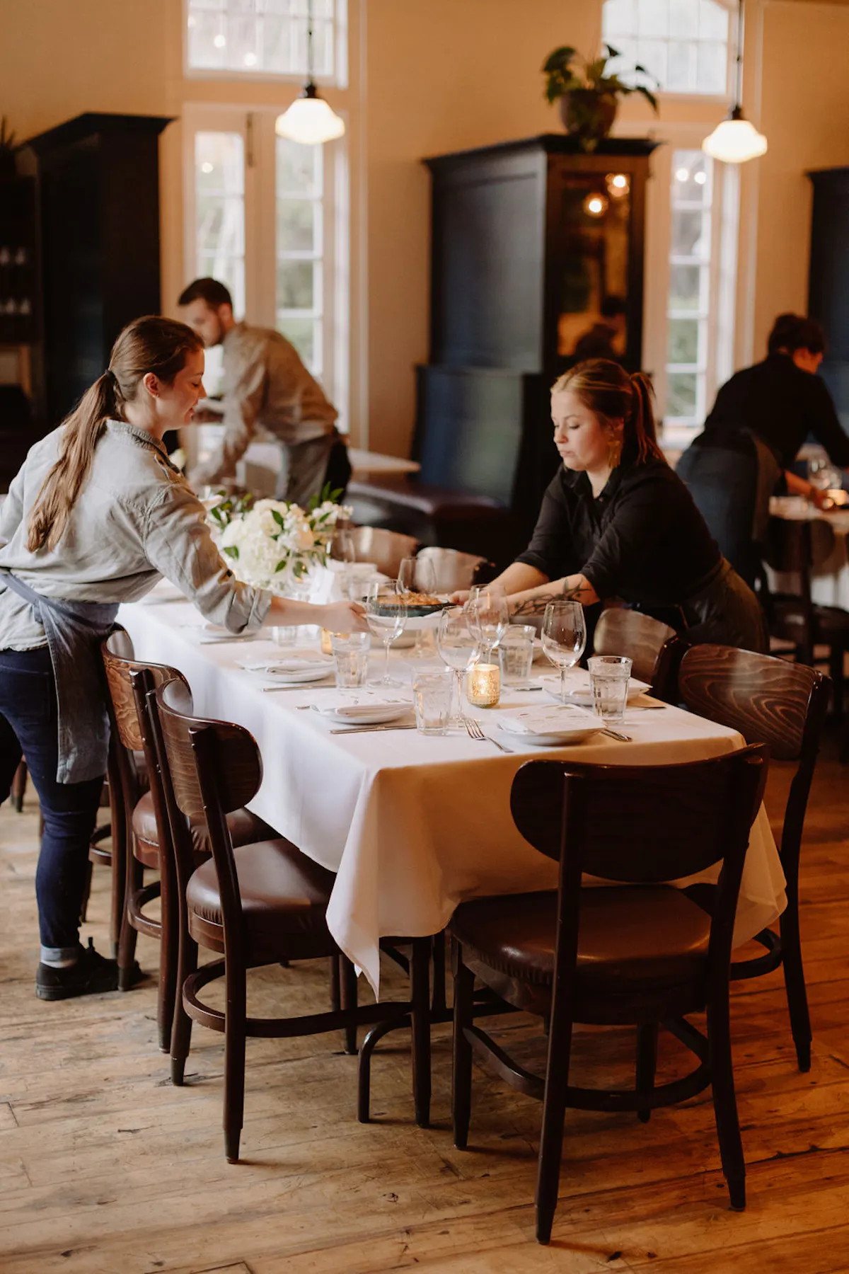 a group of people sitting at a dining table