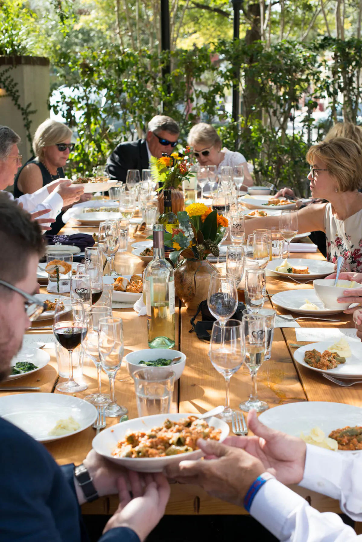 a group of people sitting at a dinner table