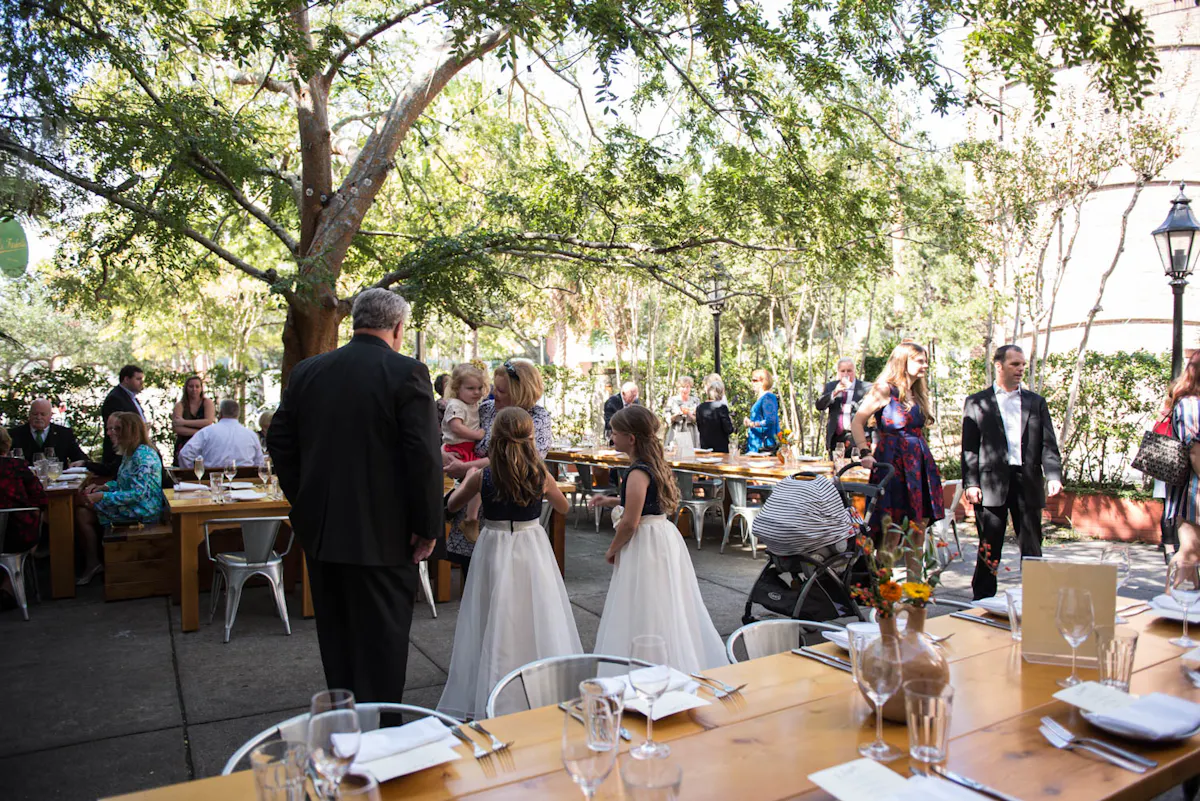 a group of people sitting at a picnic table