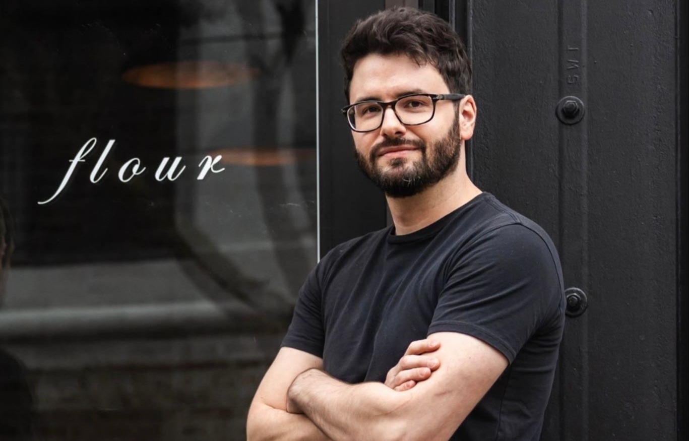 a man standing in front of a building