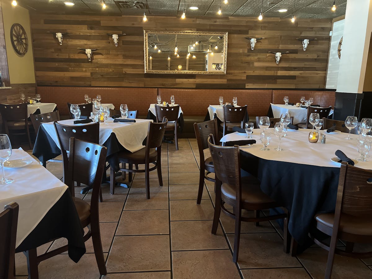 a group of people sitting at a table in a room