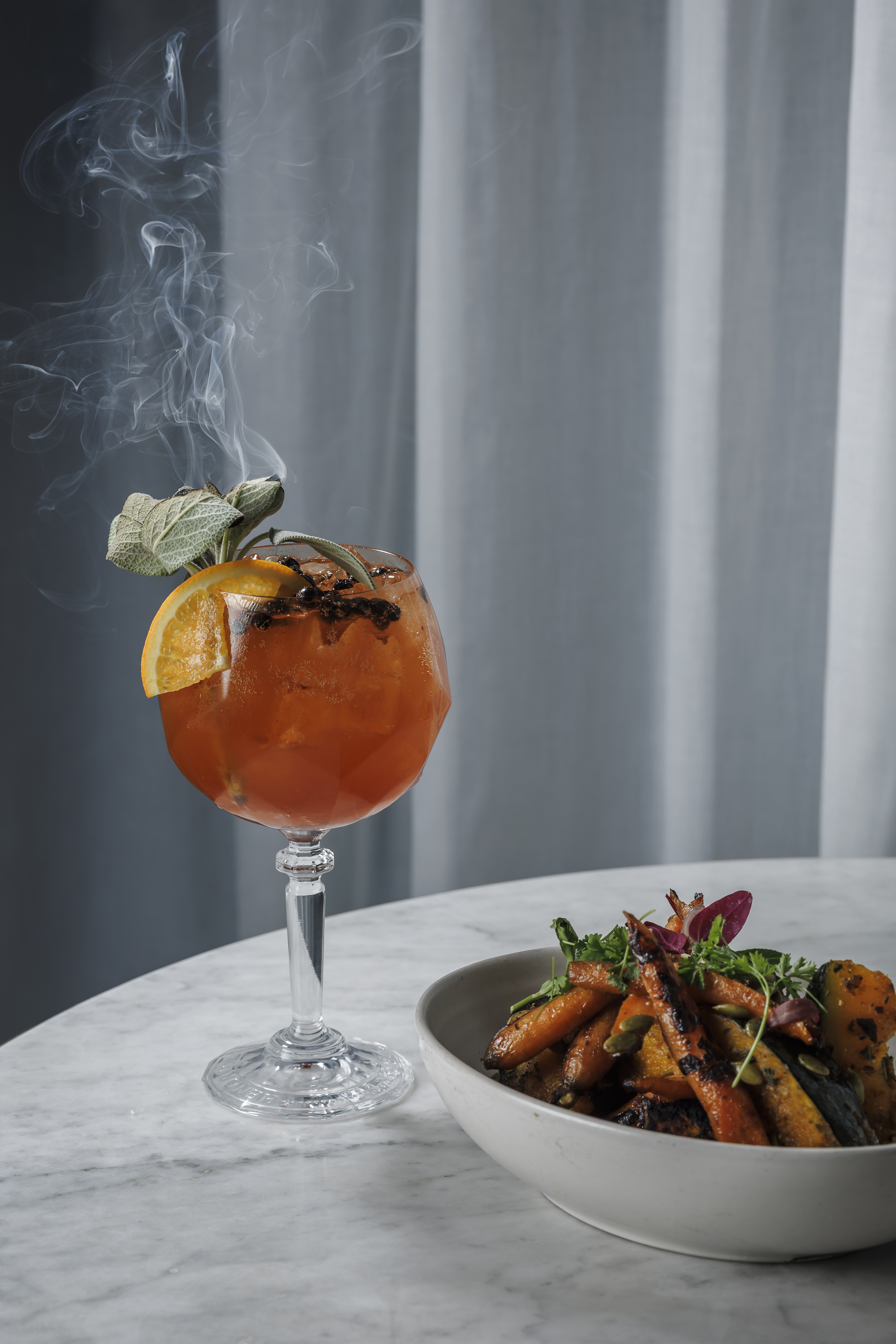 Autumn Veg  Baby carrots, buttercup squash, sage brown butter, wildflower honey, whipped feta and Dark Gold Cocktail