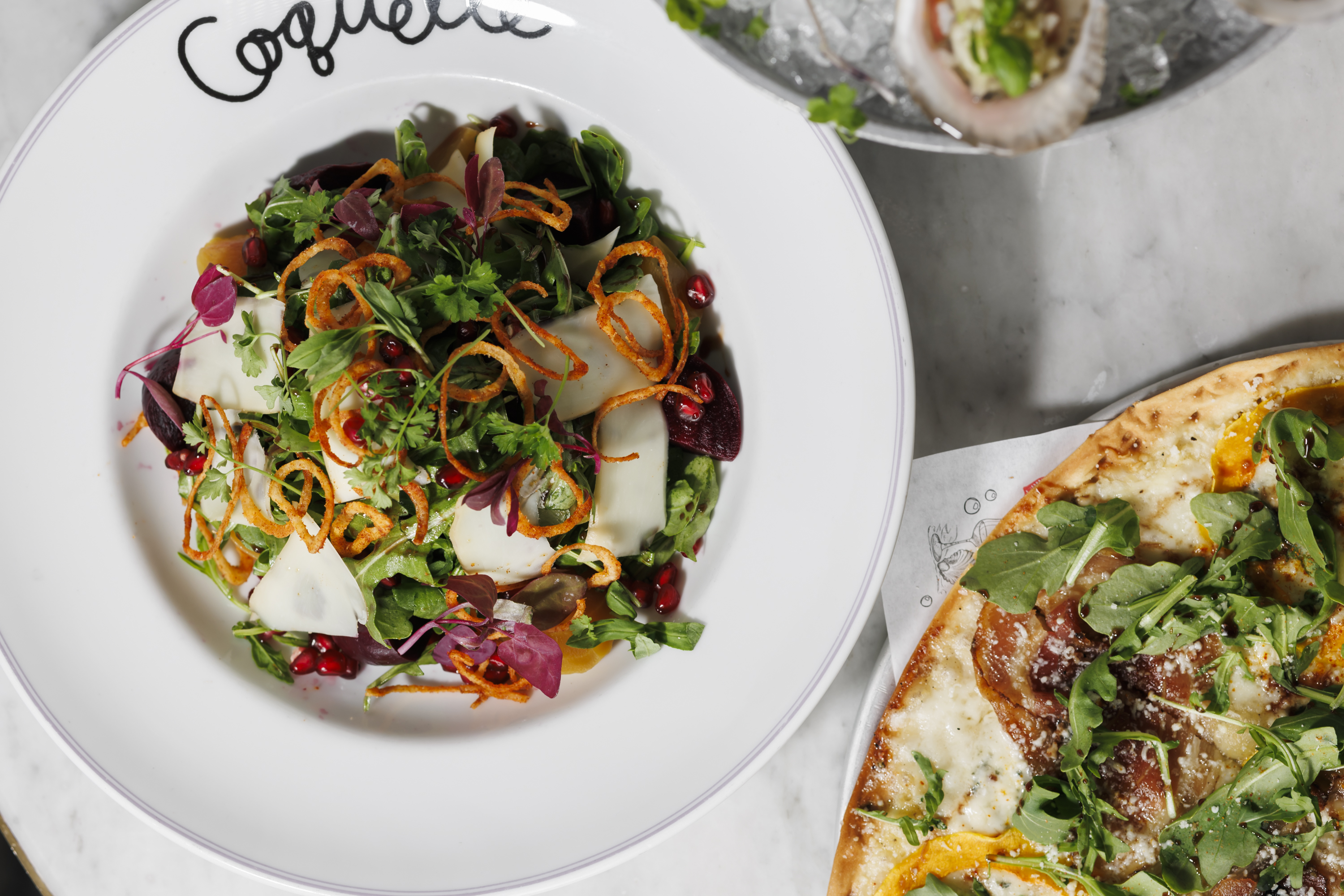 Baby Beet Salad  red quinoa, baby arugula, pomegranate vinaigrette, smoked goat cheese, crispy shallots