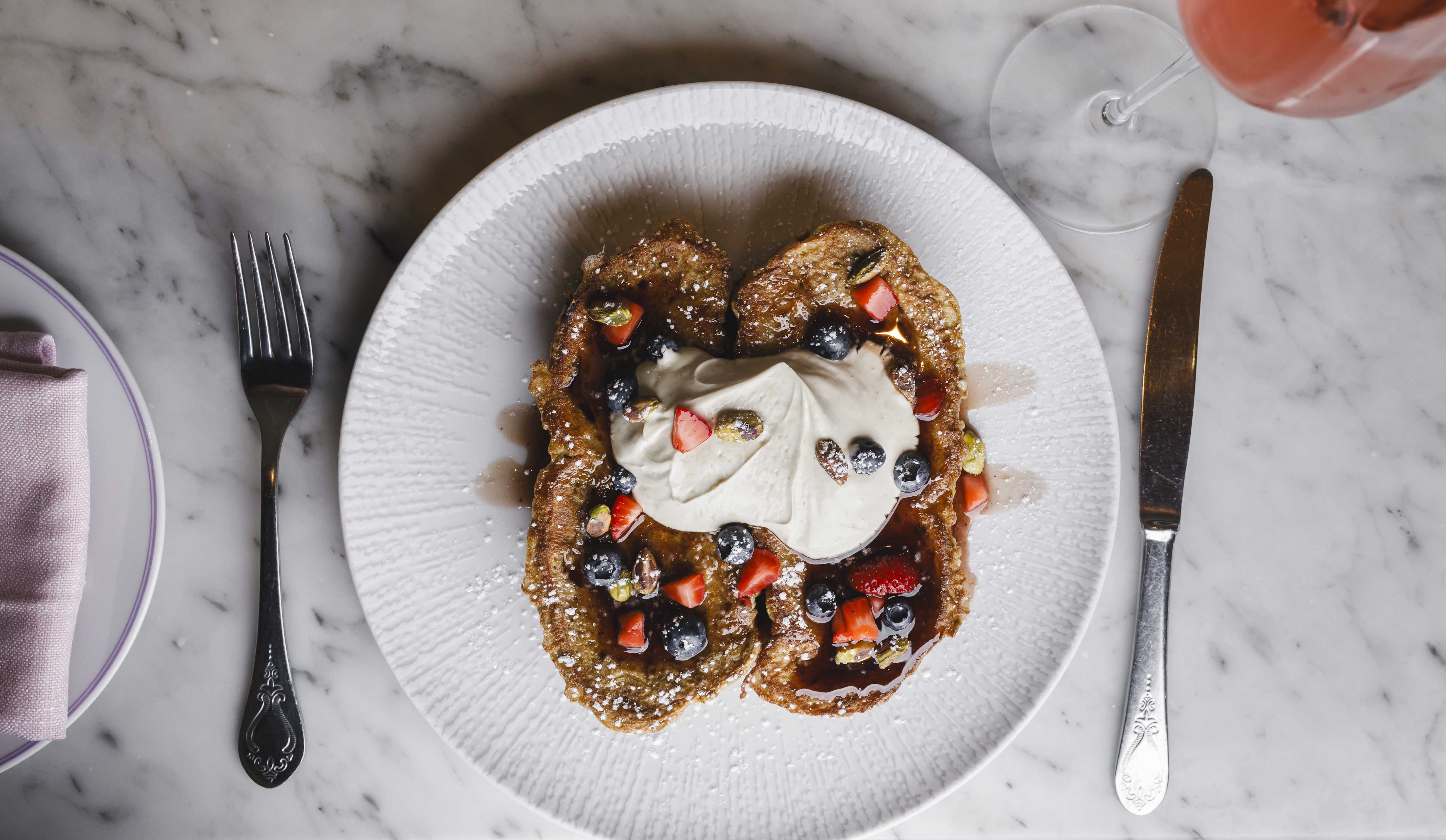 Mulberry French Toast  portuguese sweet bread, pistachio labneh, mulberry maple, berries & toasted pistachios