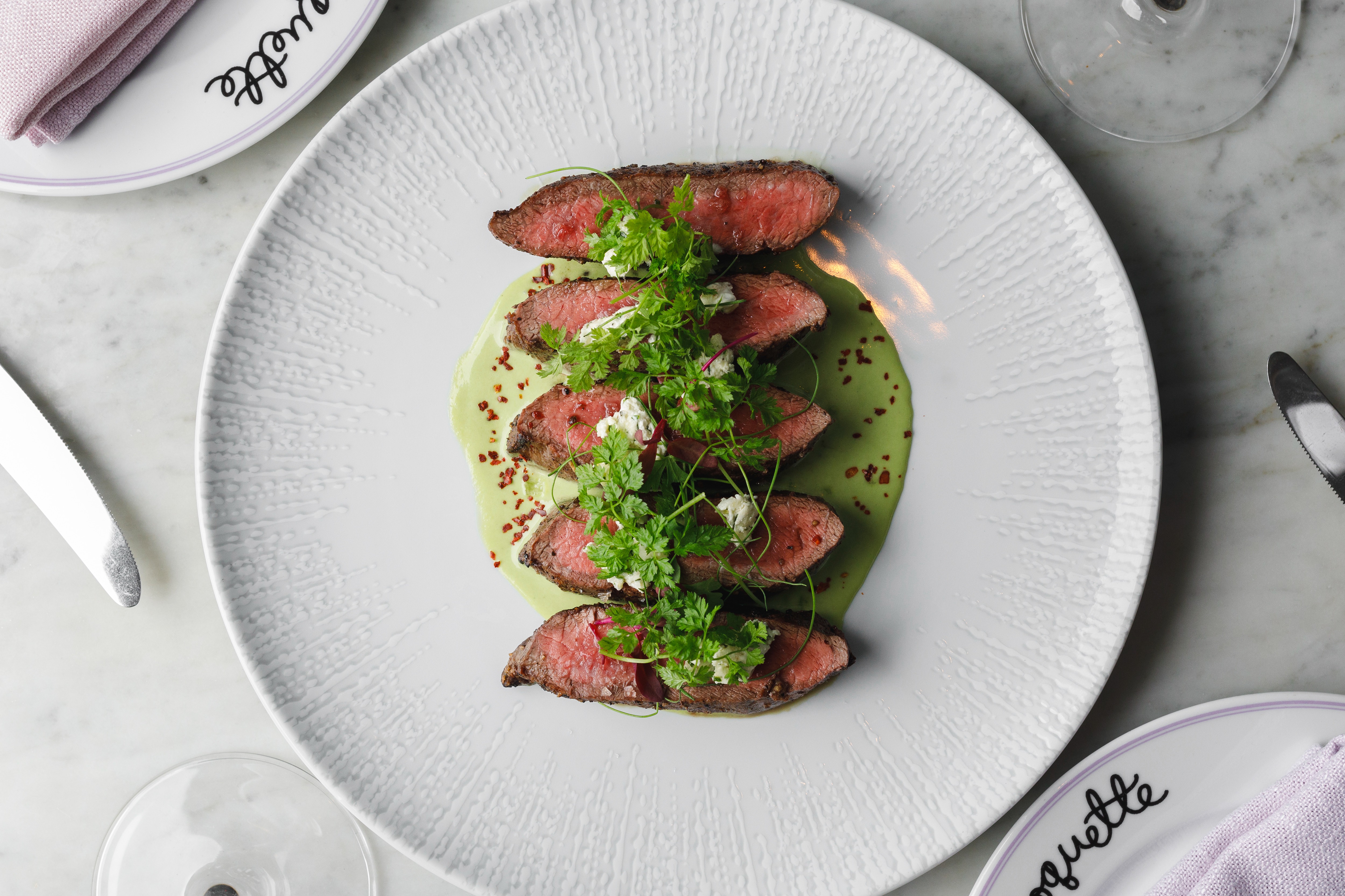 Flat Iron Steak (10 oz)  garlic herb butter, roquefort crème, fine herbs 