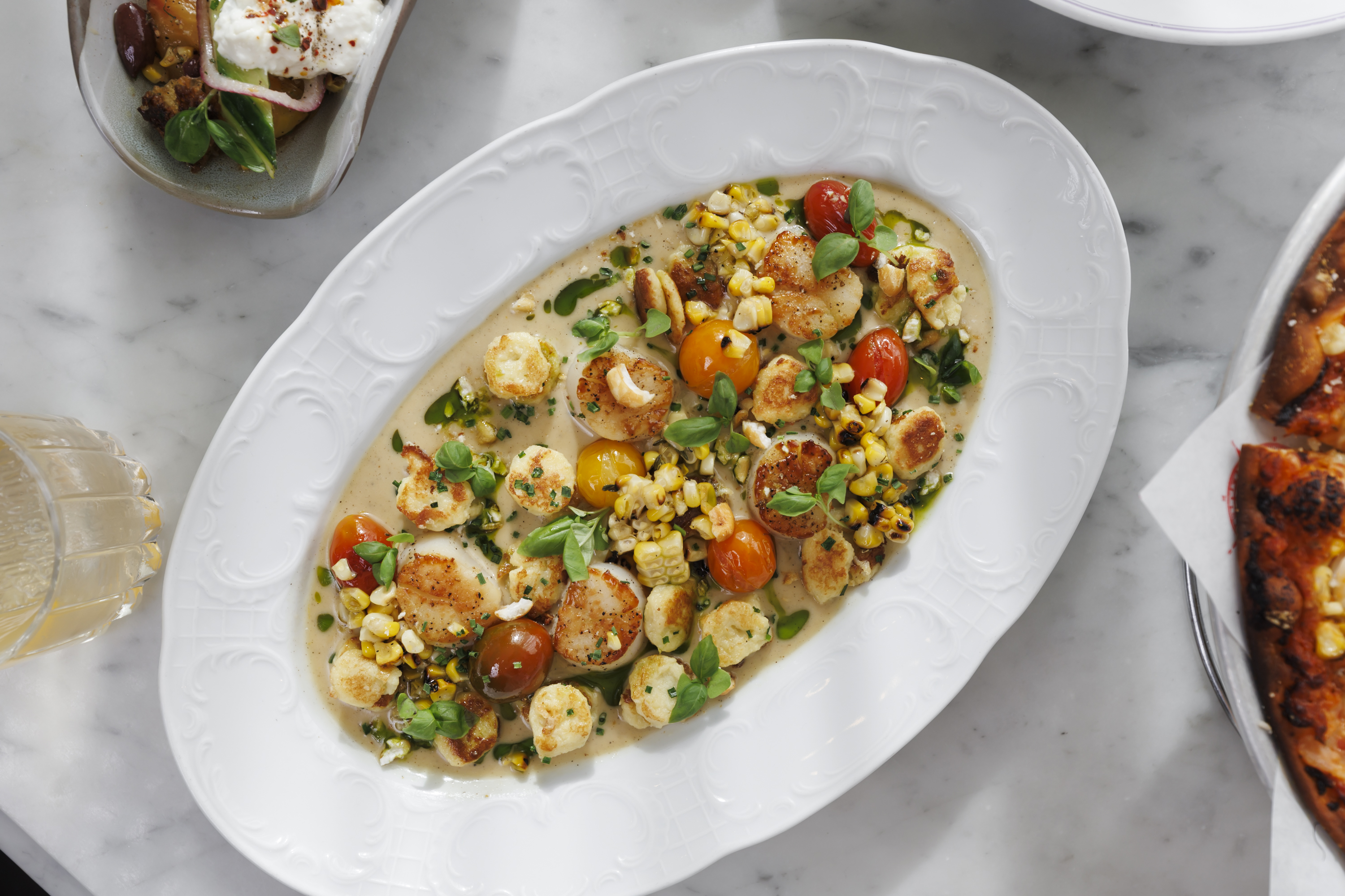 Seared Scallops  Sweet corn gnocchi, confit tomatoes, citrus beurre noisette, basil oil, grilled corn