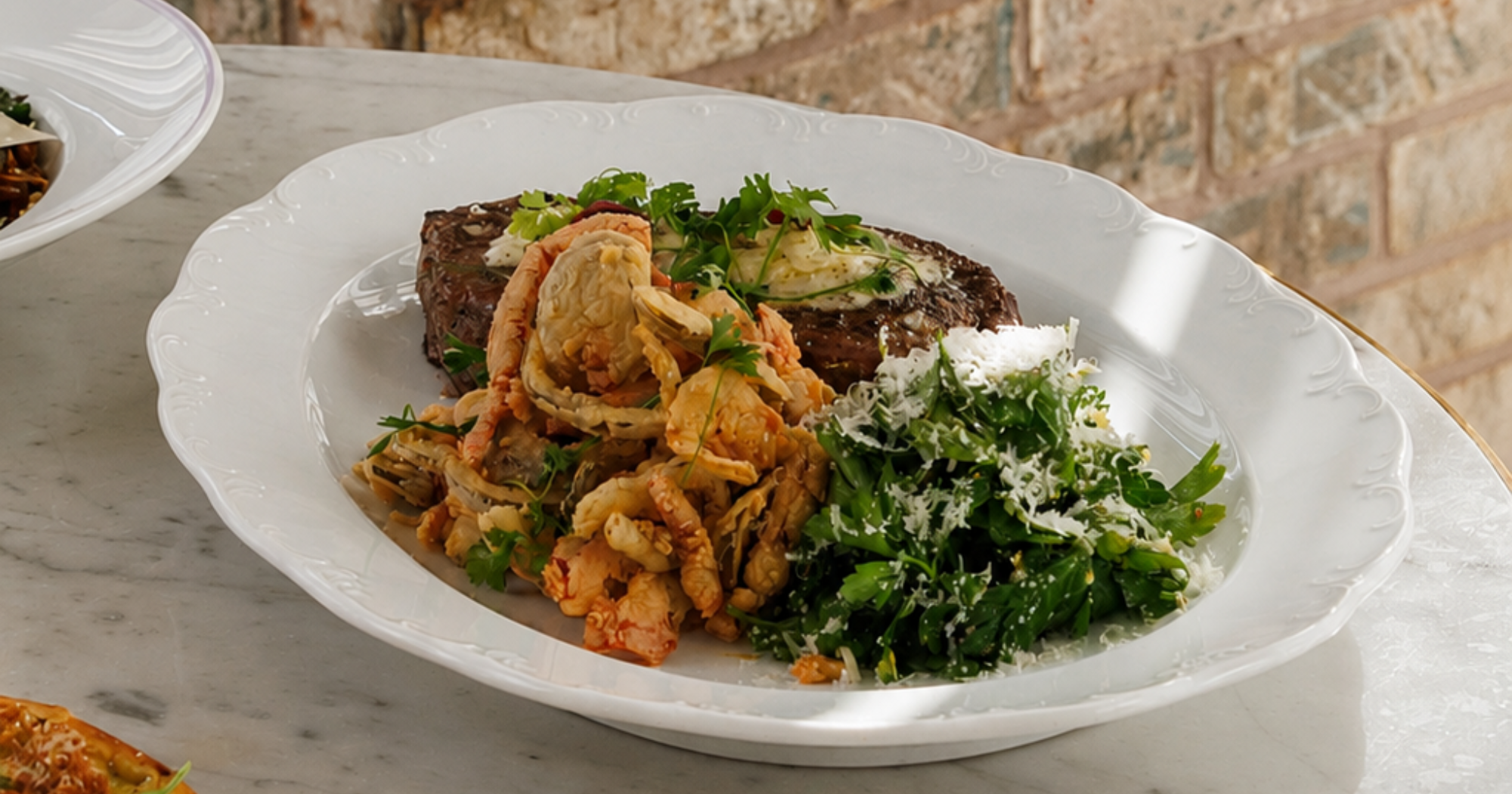Dry Aged Prime Ribeye (16oz.)*  pecorino-garlic butter, fried cherry peppers, gremolata