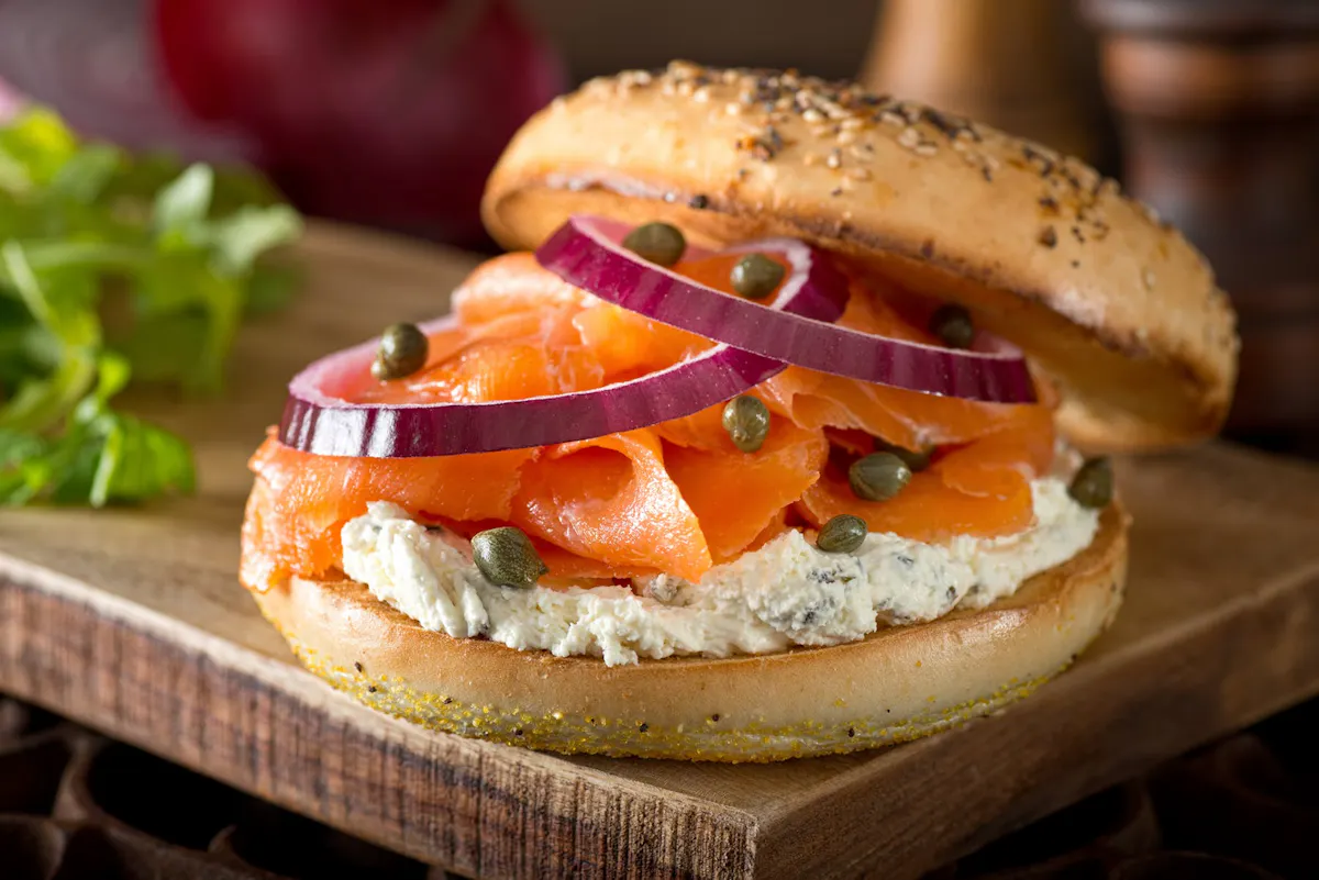 a bagel sitting on top of a wooden table