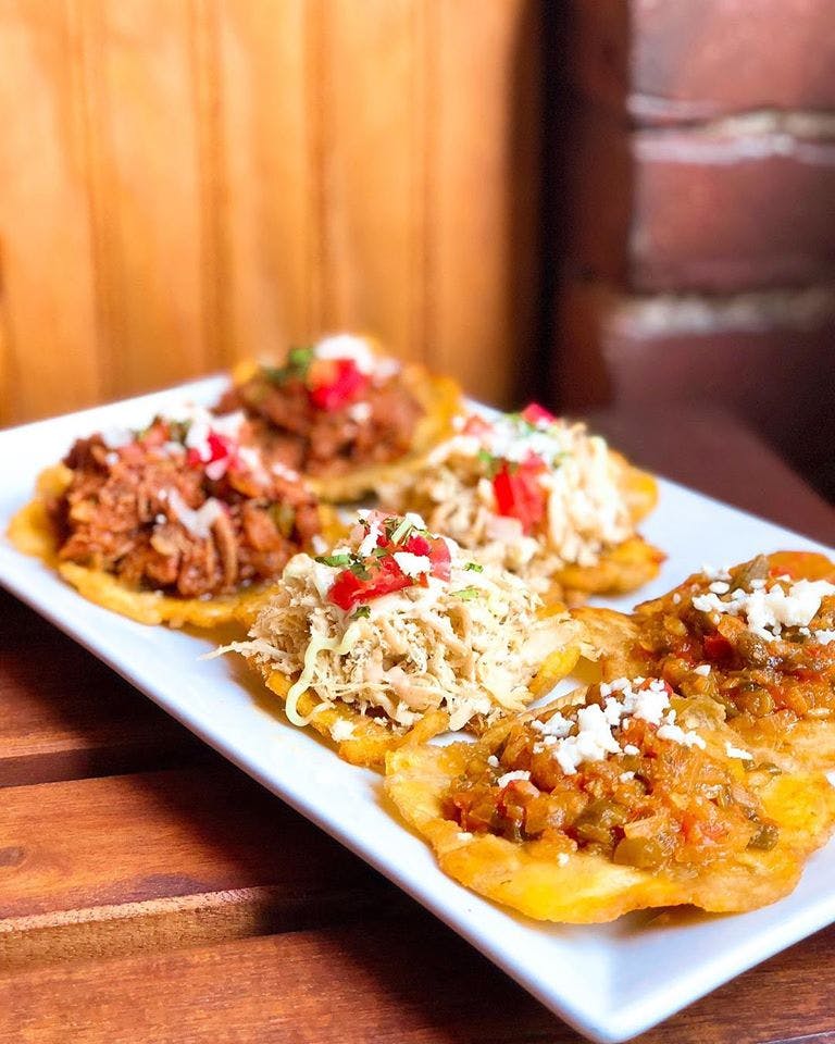 a white plate topped with enchiladas