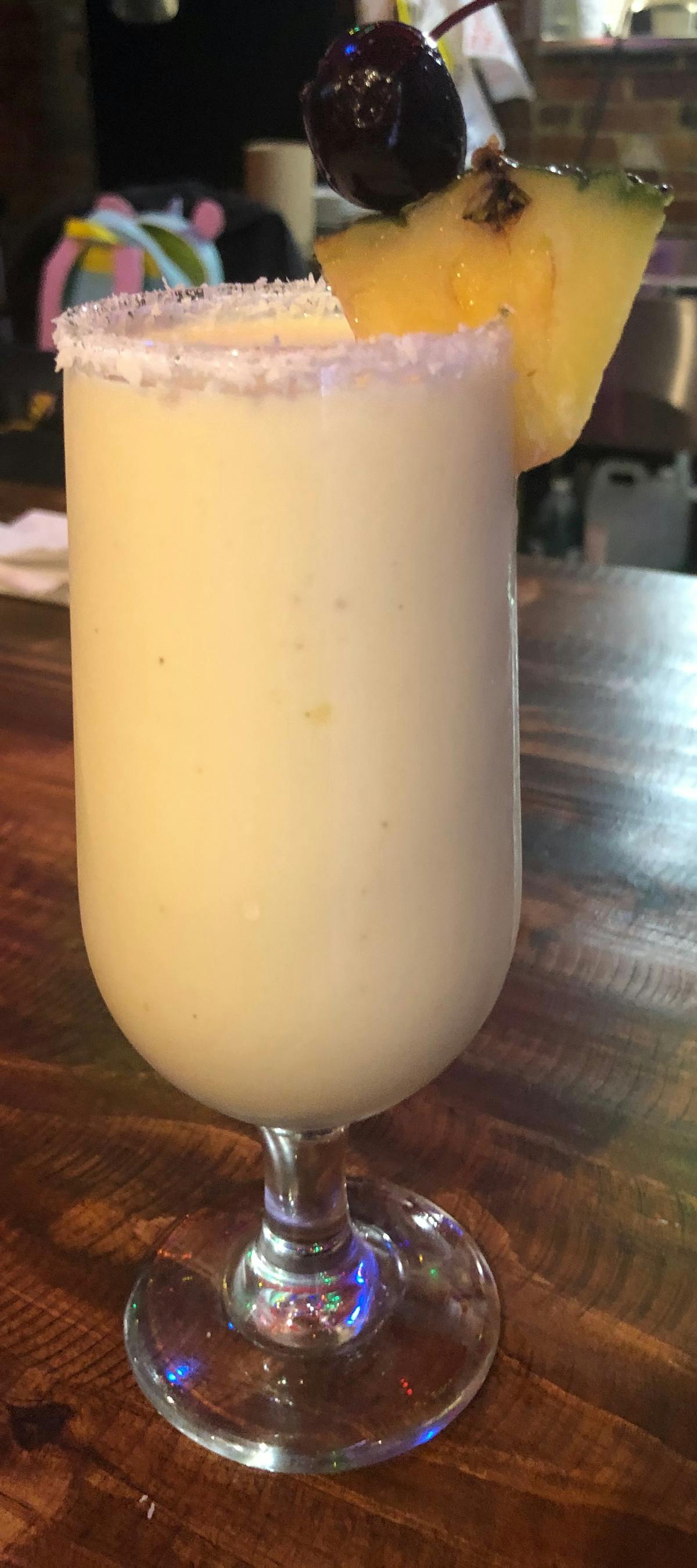 a cup of coffee and a glass of beer on a table