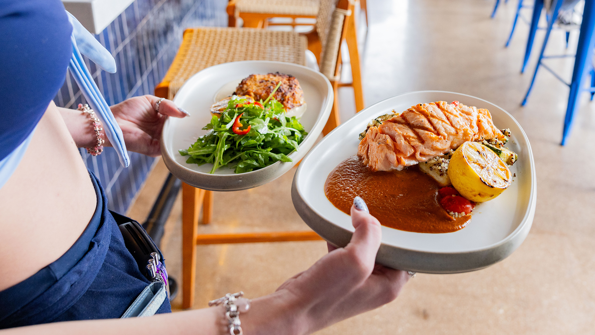 Lucky Lou's Raw Bar waitress serving food
