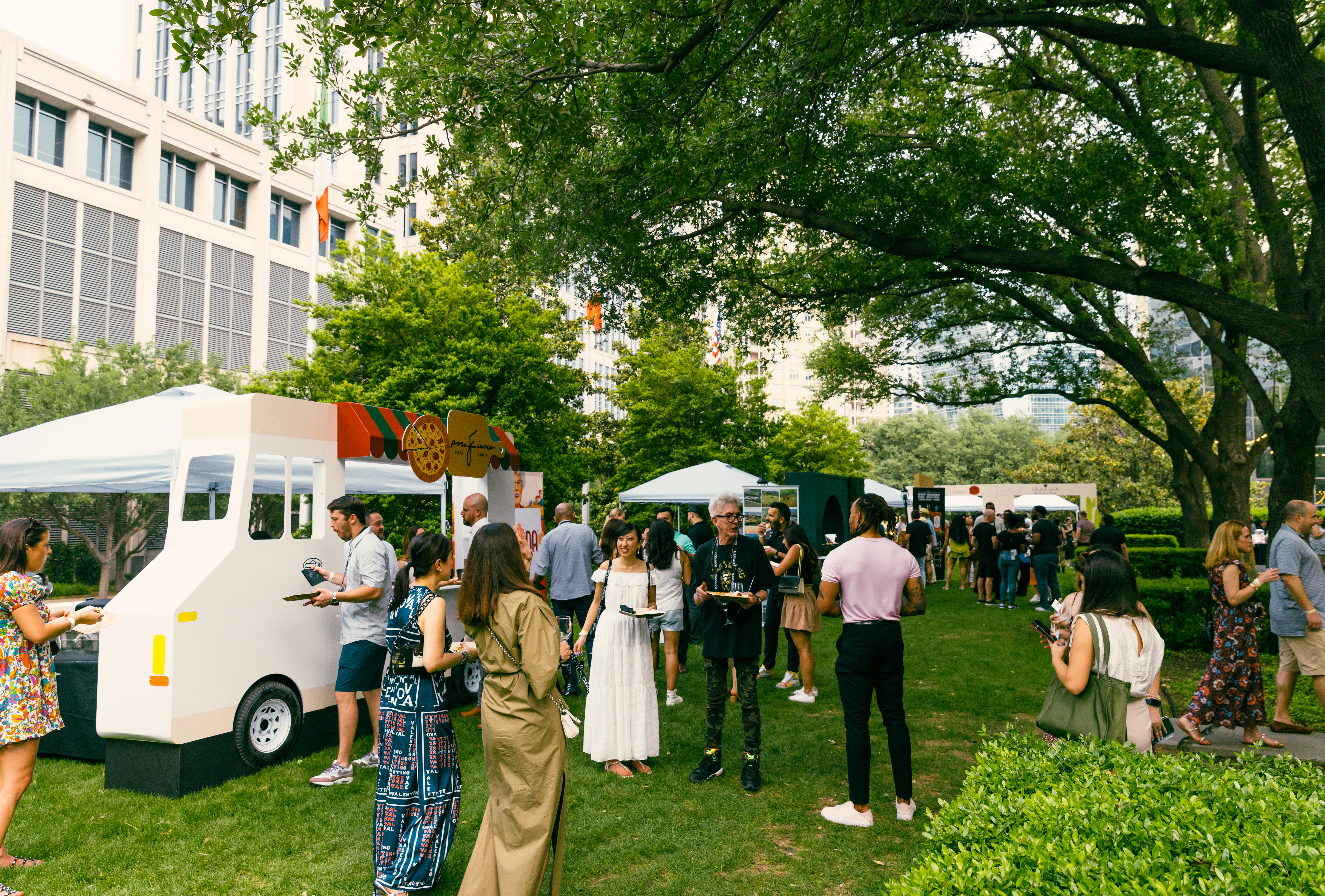 a group of people standing around a bus
