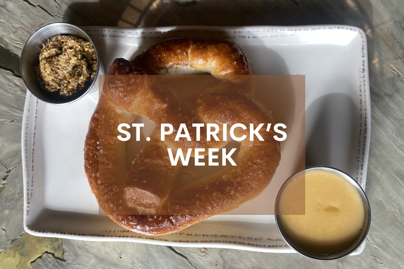 a pretzel and sauce on a plate