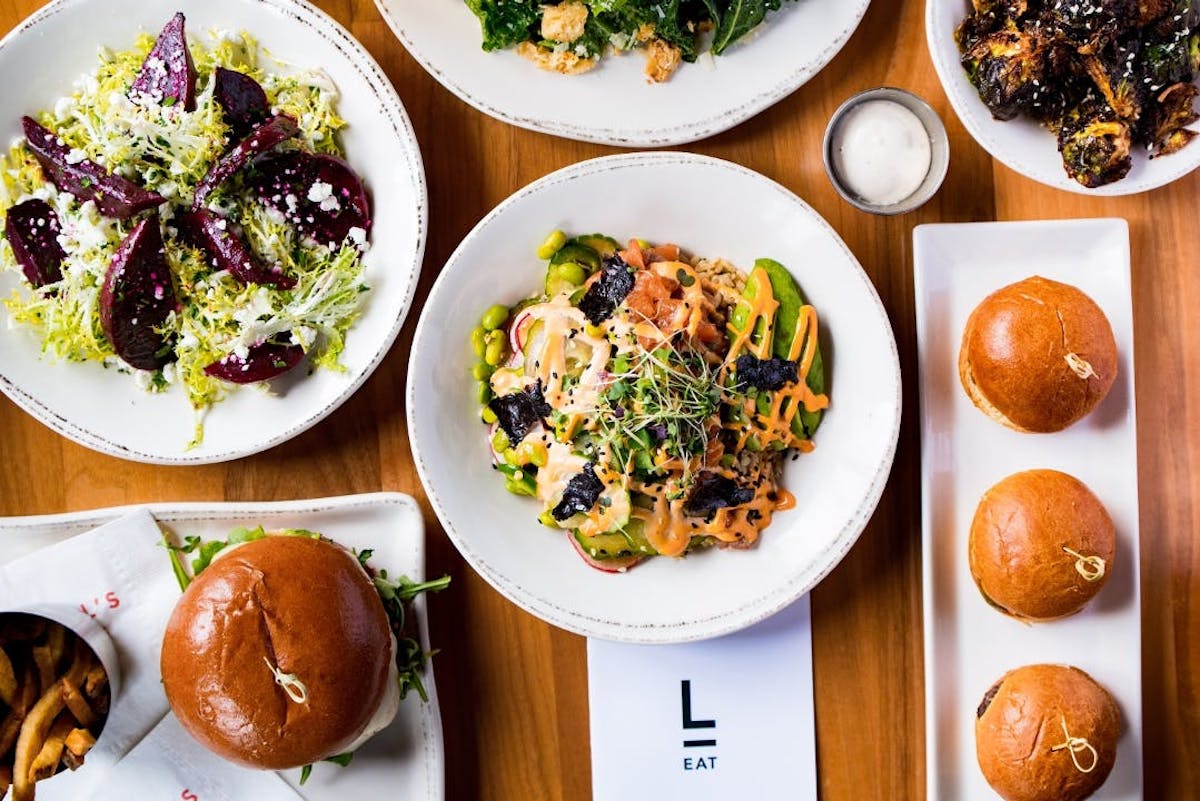 a bunch of food sitting on top of a wooden table