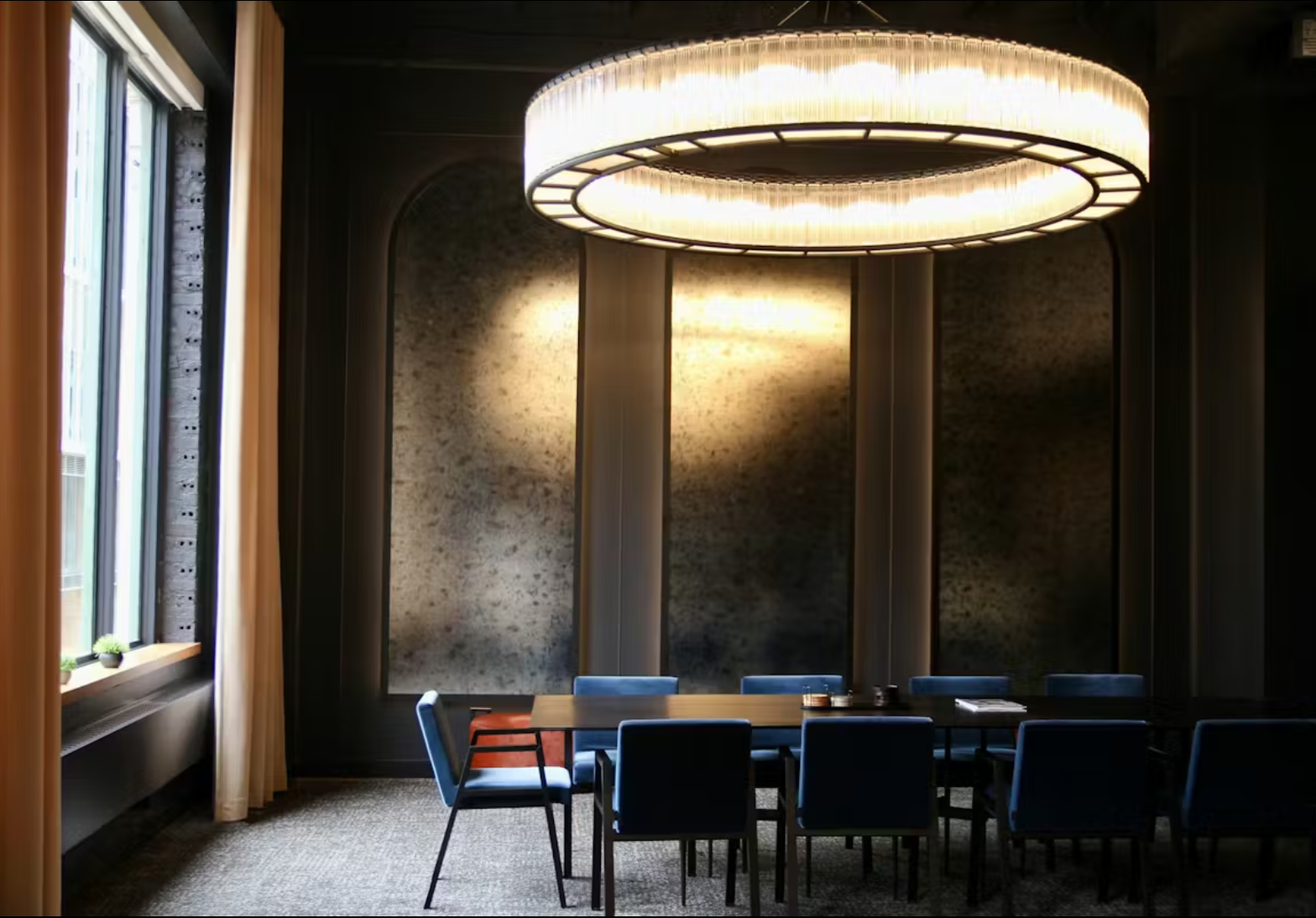 a dining room table in front of a window