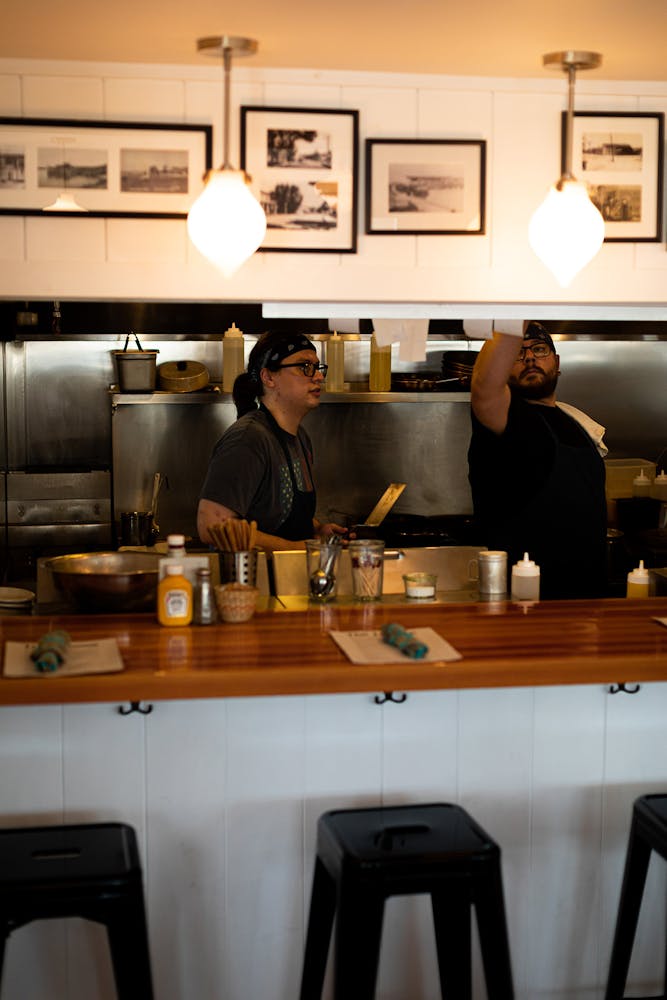 a group of people in a kitchen