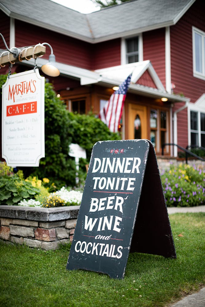 a sign in front of a house