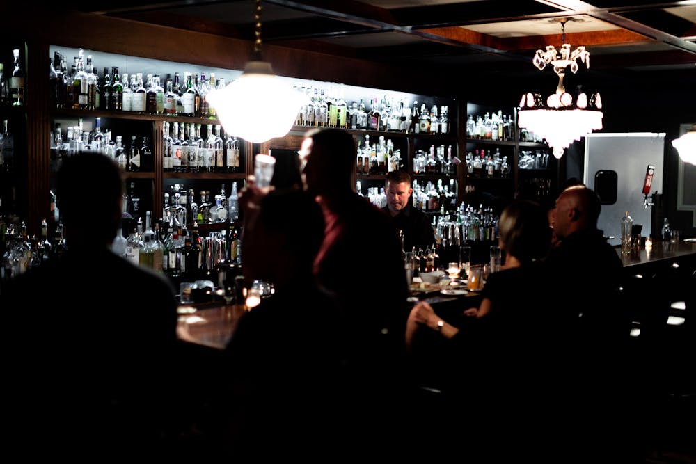 a group of people sitting at a table in a restaurant