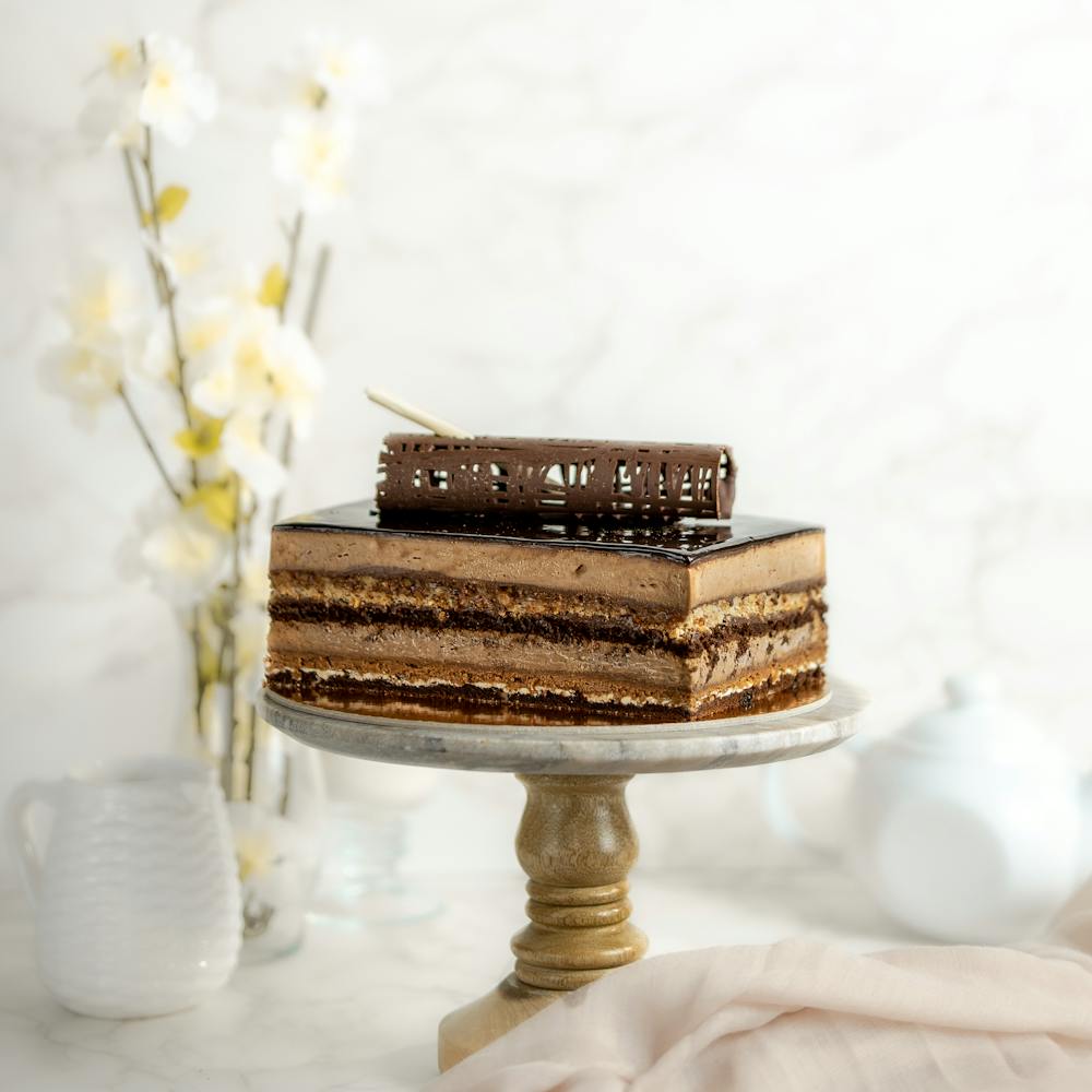 a cake sitting on top of snow covered ground