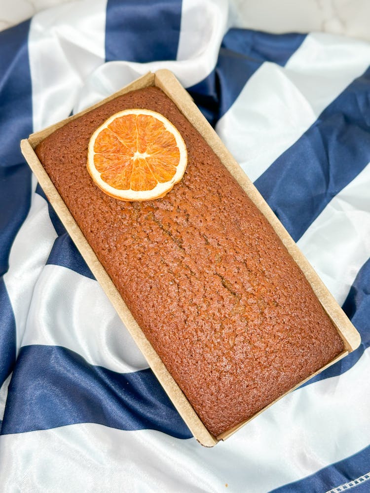 a sandwich cut in half on a blanket