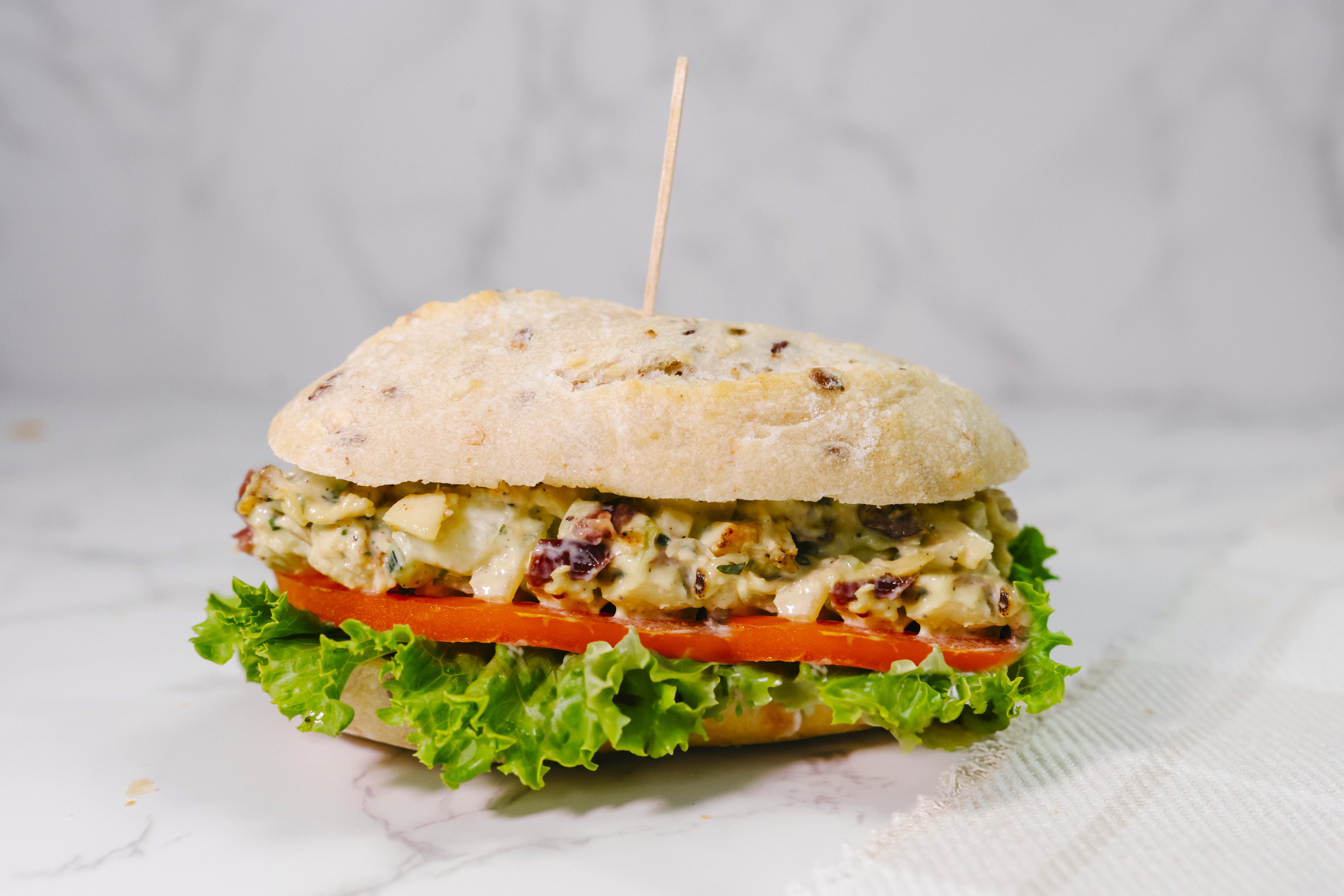a close up of a sandwich sitting on top of a table