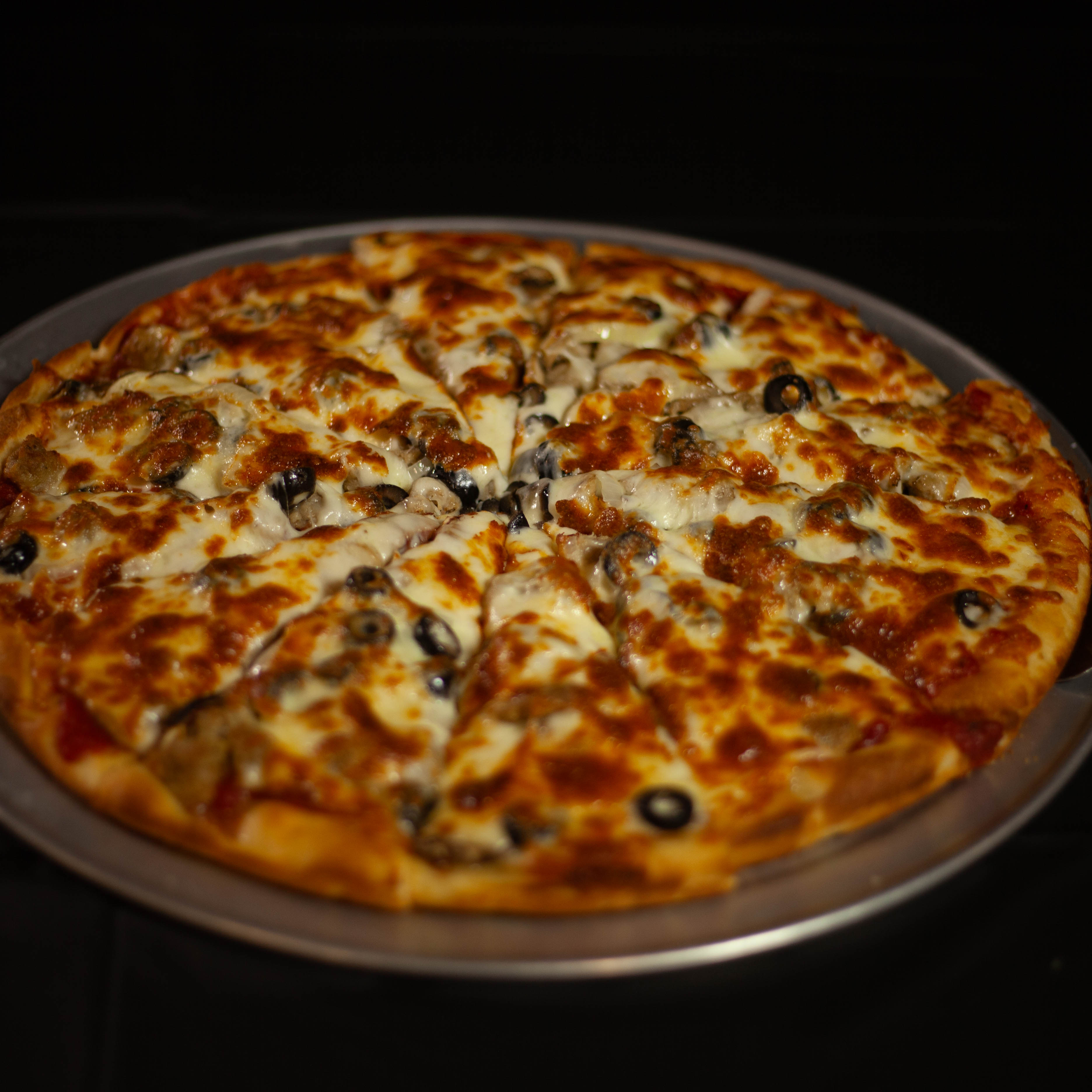 a pizza sitting on top of a table