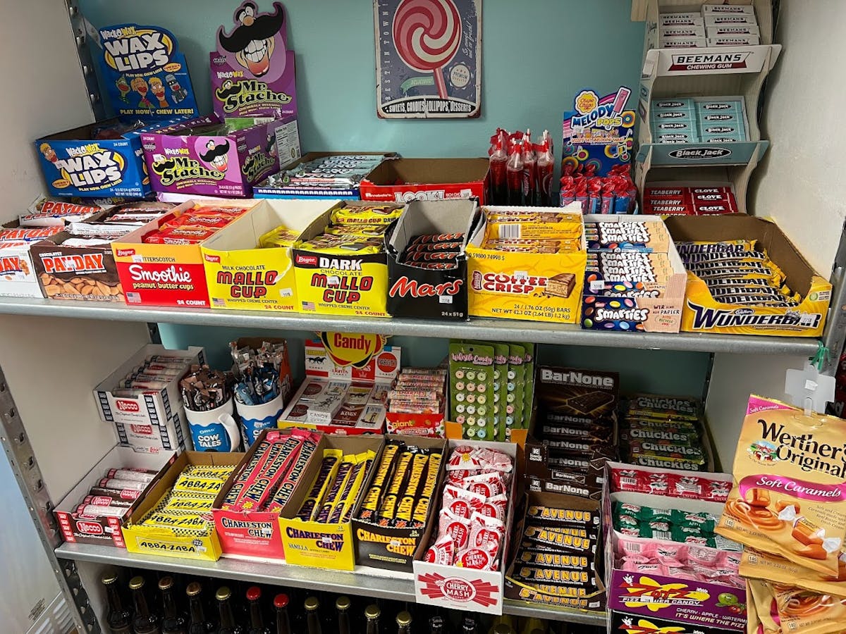 a bunch of stuffed animals on display in a store