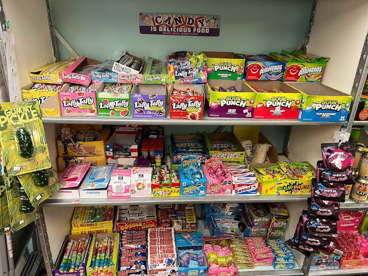 a bunch of stuffed animals on display in a store