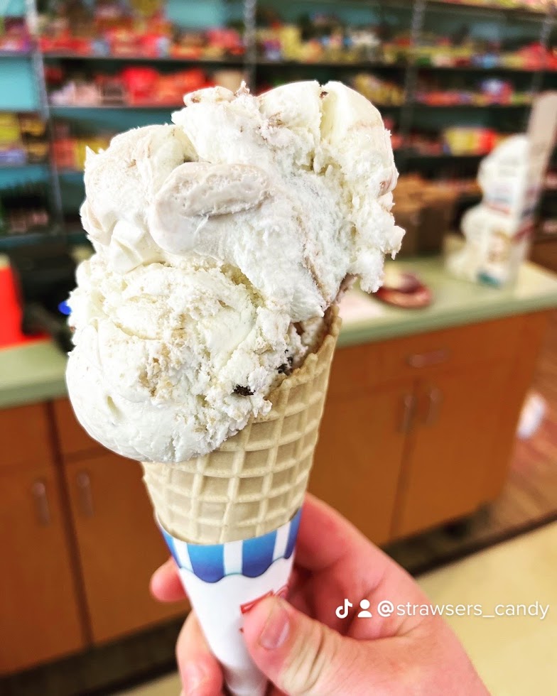 a close up of a person holding a cup