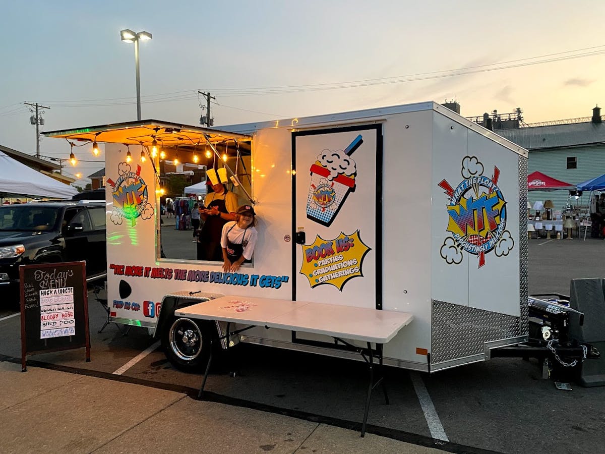 a truck is parked in front of a store