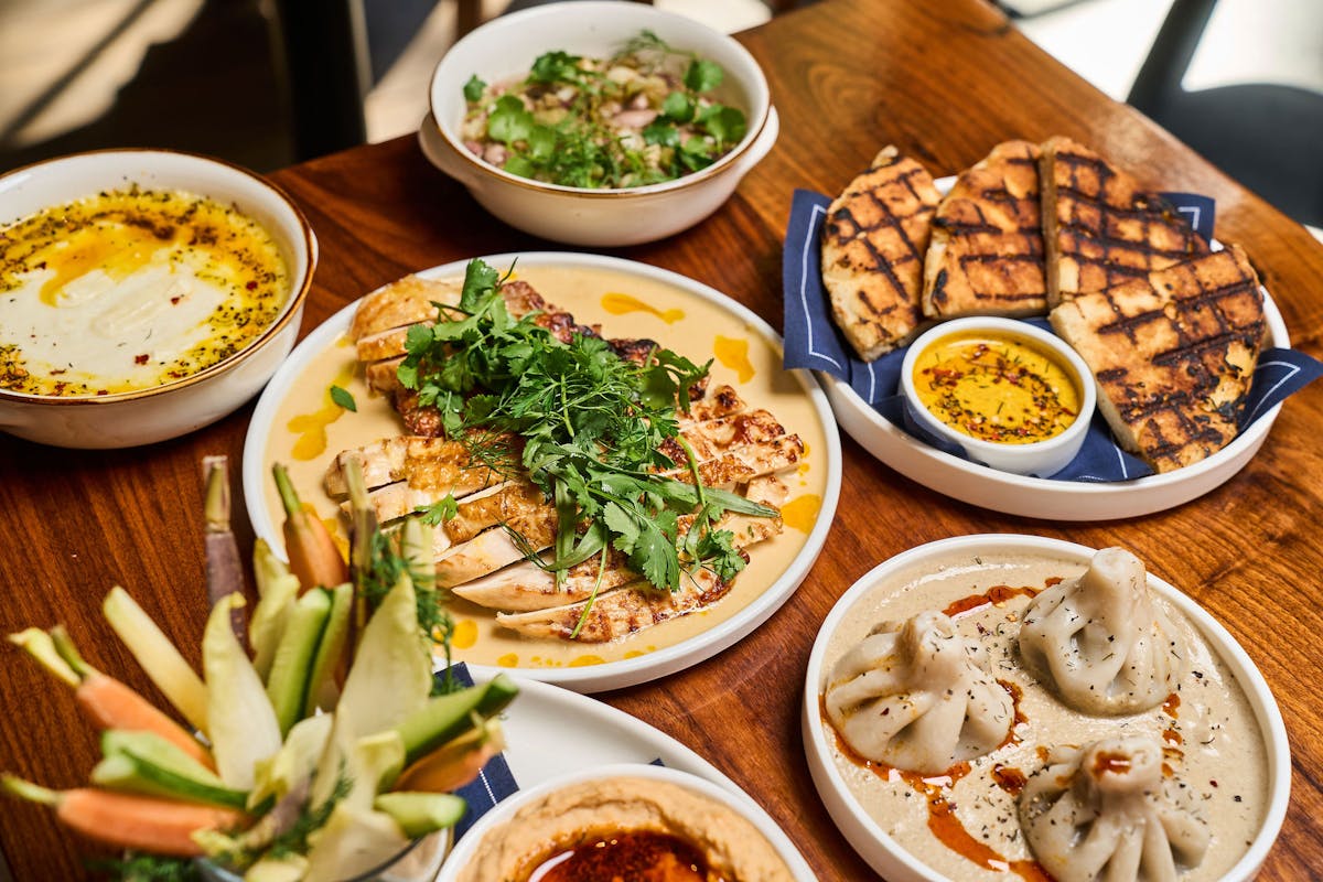 a bunch of food sitting on top of a wooden table