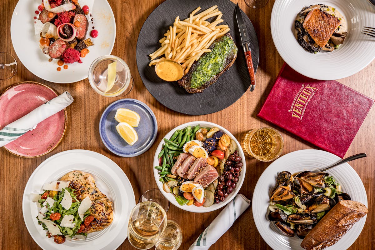 a plate is filled with different types of food on a table