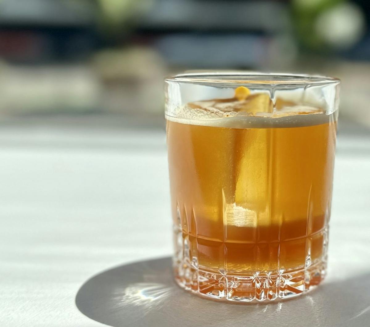 a glass of beer on a table