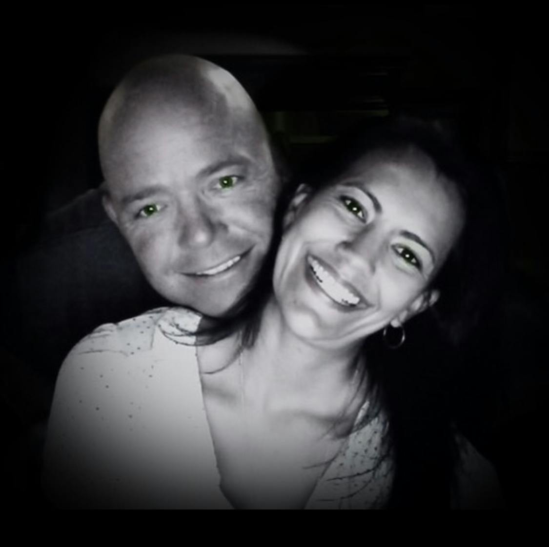 a man and woman posing for a photo