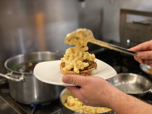 a person cooking food on a plate