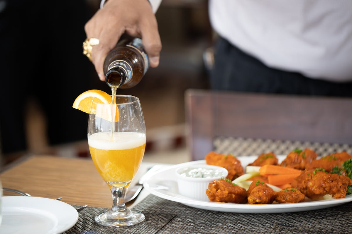 a person pouring a drink
