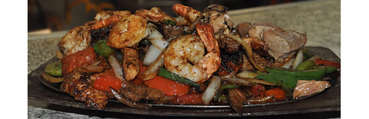 a dish is filled with meat and vegetables