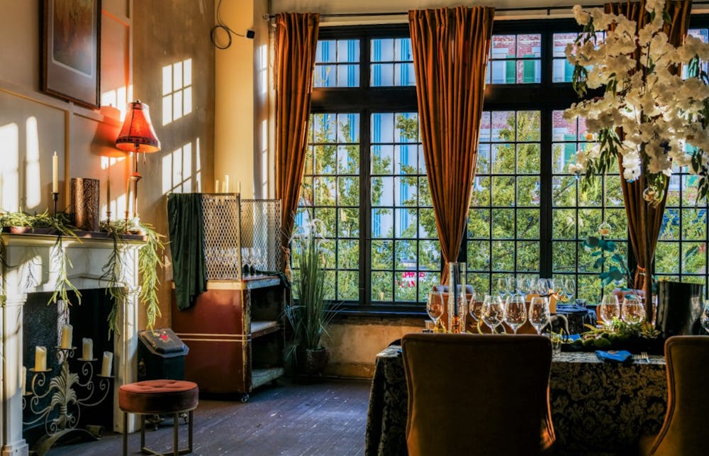 a living room filled with furniture and a large window